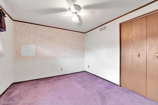 23719 Wendy Ln, Southfield, MI 48075 - unfurnished bedroom with crown molding, carpet floors, a closet, ceiling fan, and wallpapered walls