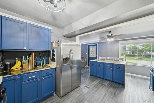 1333 N Franklin St, Dearborn, MI 48128 - kitchen featuring stainless steel fridge, blue cabinets, light wood-type flooring, and ceiling fan