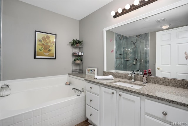 28185 Carlton Way Dr, Novi, MI 48377 - full bathroom featuring vanity, a shower stall, and a garden tub