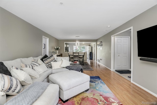 28185 Carlton Way Dr, Novi, MI 48377 - living area with wood finished floors and a chandelier
