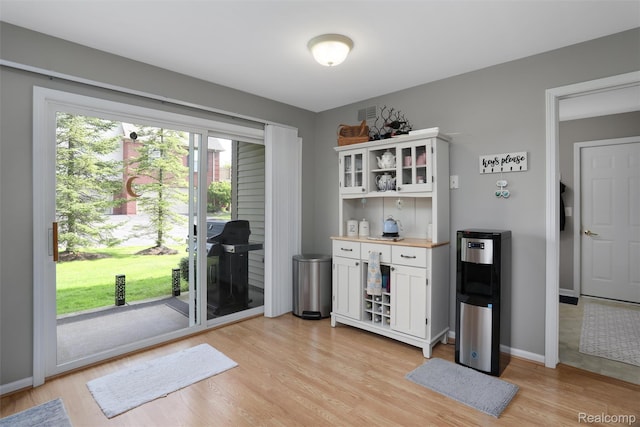 28185 Carlton Way Dr, Novi, MI 48377 - indoor dry bar with light wood-type flooring and baseboards