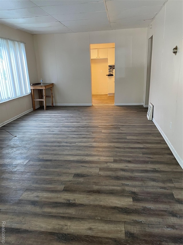 747 Vermilya Ave, Flint, MI 48507 - spare room with dark wood finished floors and baseboards
