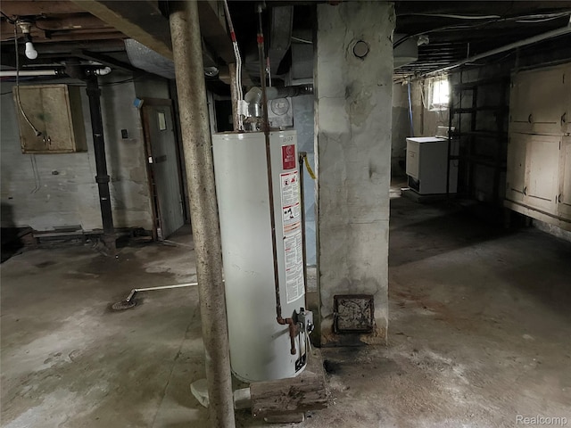 747 Vermilya Ave, Flint, MI 48507 - below grade area with gas water heater and washer / dryer