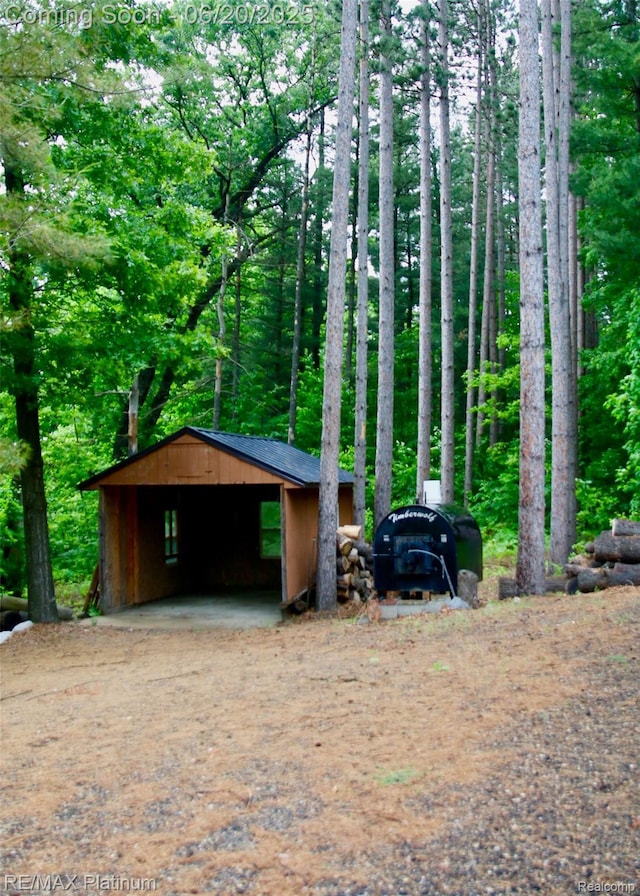 3199 N Loop Ct, Middleville, MI 49333 - view of outdoor structure featuring dirt driveway and a detached carport
