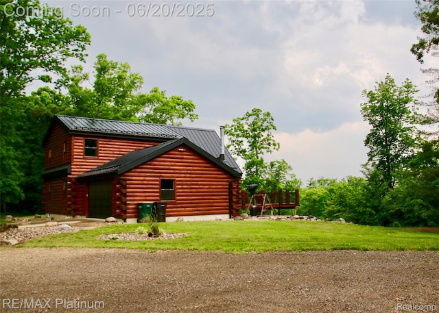 3199 N Loop Ct, Middleville, MI 49333 - view of property exterior featuring log exterior, a metal roof, a standing seam roof, and a lawn