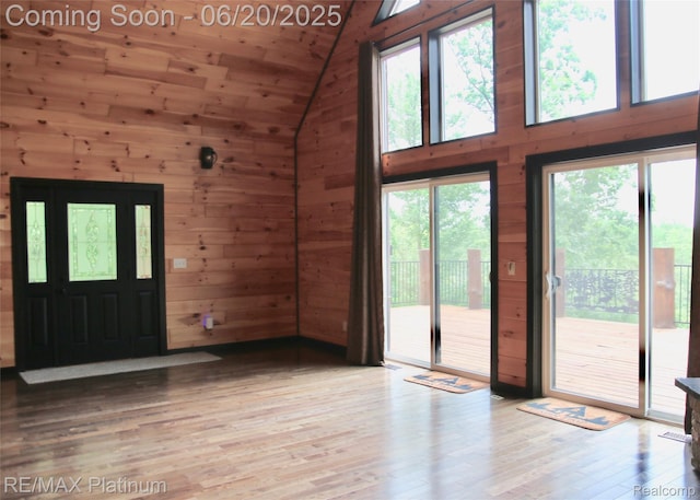 3199 N Loop Ct, Middleville, MI 49333 - foyer entrance featuring wooden walls, wood finished floors, wooden ceiling, and high vaulted ceiling