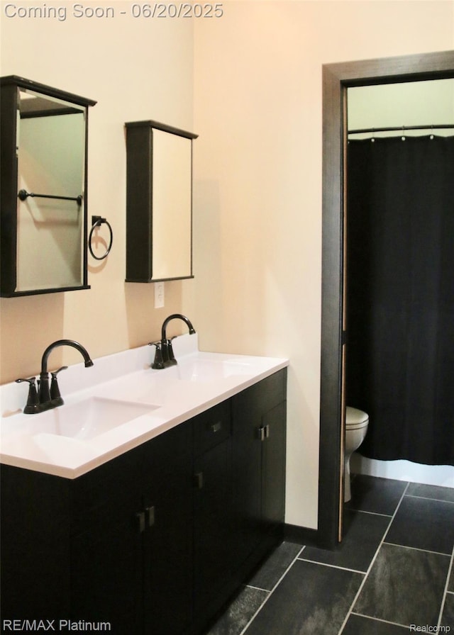 3199 N Loop Ct, Middleville, MI 49333 - bathroom with double vanity and tile patterned flooring