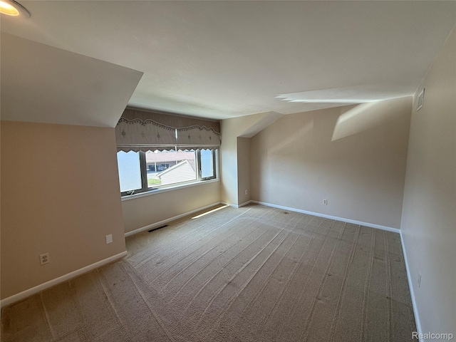 6352 Laurentian Ct, Flint, MI 48532 - additional living space with carpet flooring and lofted ceiling