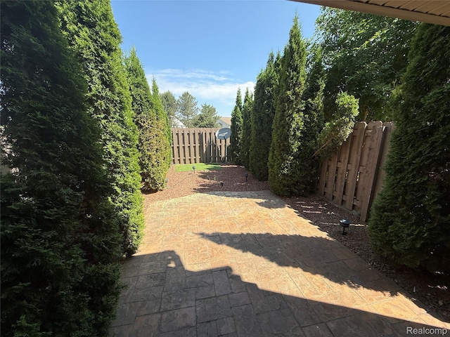 6352 Laurentian Ct, Flint, MI 48532 - fenced backyard featuring a patio