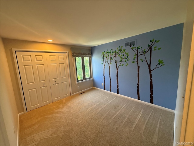 6352 Laurentian Ct, Flint, MI 48532 - unfurnished bedroom with carpet flooring, a closet, and recessed lighting