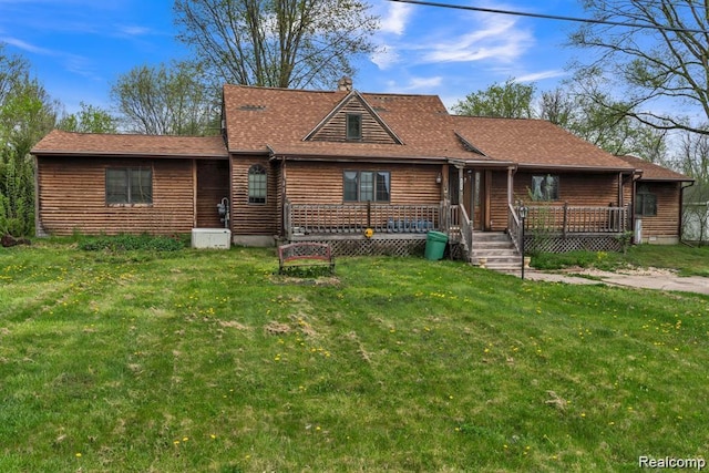 6456 W Court St, Flint, MI 48532 - view of front of home featuring a front yard, a deck, and a chimney