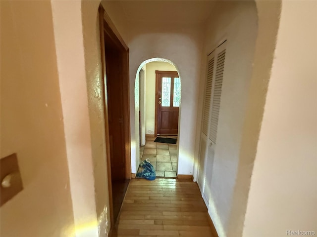 6456 W Court St, Flint, MI 48532 - hallway featuring arched walkways and wood-type flooring