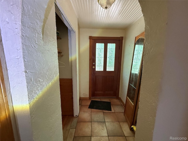 6456 W Court St, Flint, MI 48532 - entryway featuring a textured wall, light tile patterned floors, and arched walkways