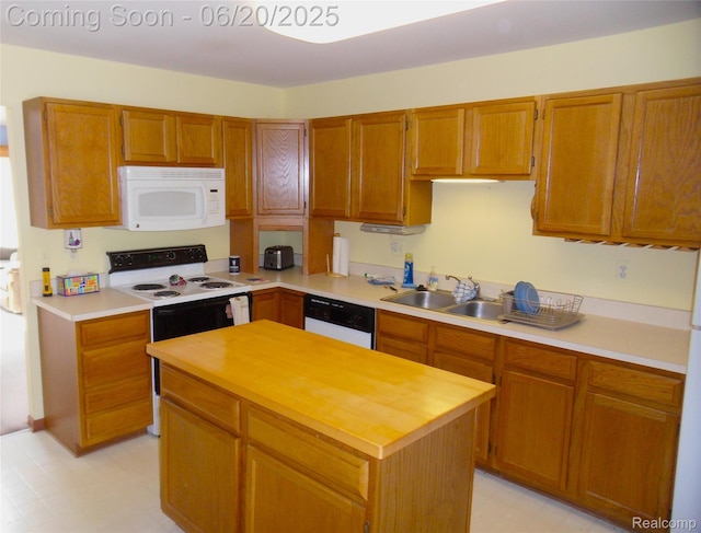 2791 Lochmoor Blvd Unit 21, Lake Orion, MI 48360 - kitchen featuring white appliances, light floors, a kitchen island, and brown cabinetry
