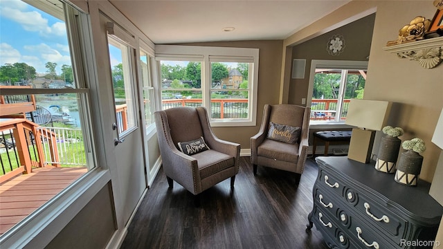 3900 Hillcrest, Highland, MI 48356 - living area with dark wood-style floors and vaulted ceiling