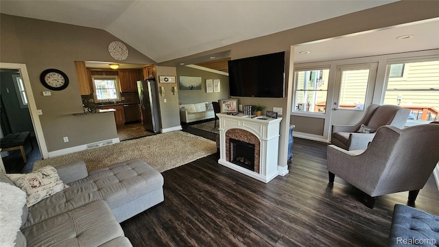3900 Hillcrest, Highland, MI 48356 - living room with dark wood finished floors and vaulted ceiling