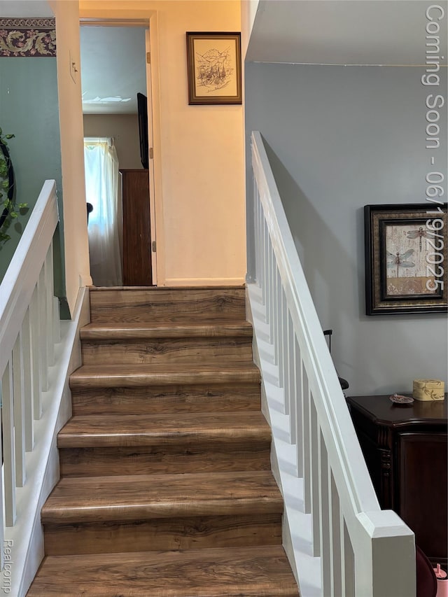 4817 Hickory Dr, Highland, MI 48356 - staircase featuring wood finished floors