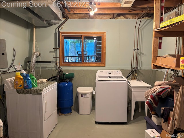 4817 Hickory Dr, Highland, MI 48356 - washroom with independent washer and dryer and electric panel