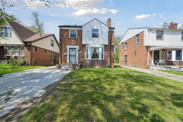 15477 Lauder St, Detroit, MI 48227 - view of front of home with a front lawn and brick siding