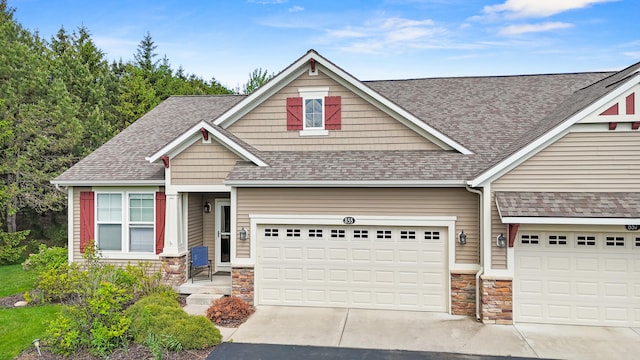 855 Cooks Crossing Dr SE, Byron Center, MI 49315 - craftsman inspired home with stone siding, a shingled roof, concrete driveway, and an attached garage