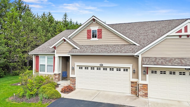 855 Cooks Crossing Dr SE, Byron Center, MI 49315 - craftsman-style home with stone siding, driveway, a shingled roof, and an attached garage