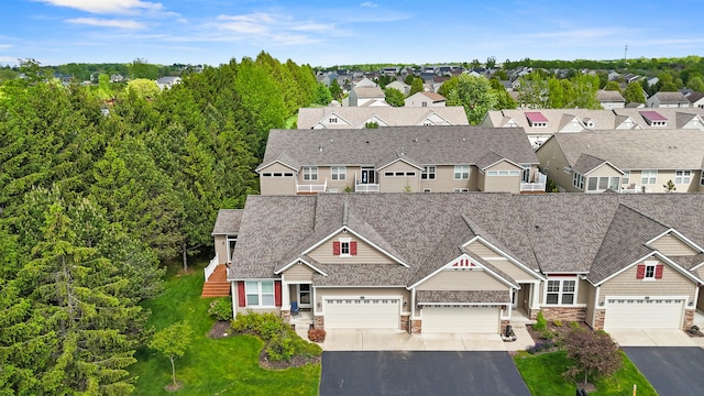 855 Cooks Crossing Dr SE, Byron Center, MI 49315 - view of front facade featuring asphalt driveway, stone siding, and a shingled roof