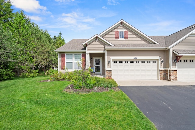 855 Cooks Crossing Dr SE, Byron Center, MI 49315 - craftsman-style house with a front lawn, driveway, roof with shingles, an attached garage, and stone siding