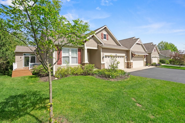 855 Cooks Crossing Dr SE, Byron Center, MI 49315 - craftsman-style house featuring a garage, driveway, a front lawn, stone siding, and a shingled roof