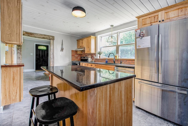 8041 Donovan Rd, Dexter, MI 48130 - kitchen featuring appliances with stainless steel finishes, wooden ceiling, a breakfast bar, under cabinet range hood, and a kitchen island