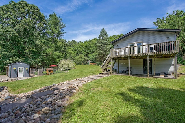 8041 Donovan Rd, Dexter, MI 48130 - view of green lawn featuring a wooden deck, a shed, and stairway