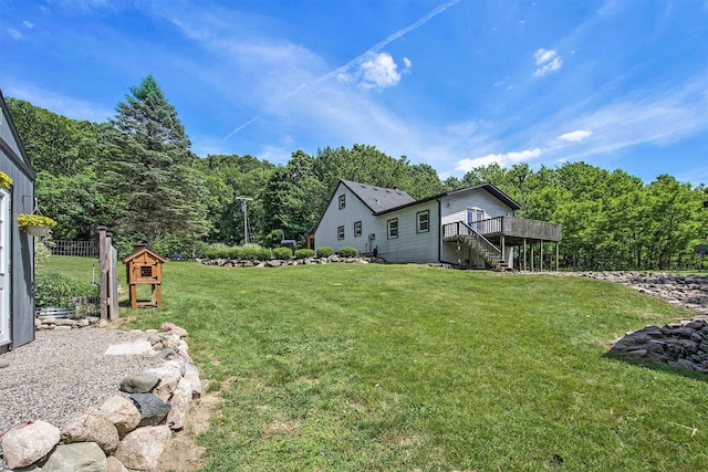 8041 Donovan Rd, Dexter, MI 48130 - view of grassy yard featuring stairs and a deck