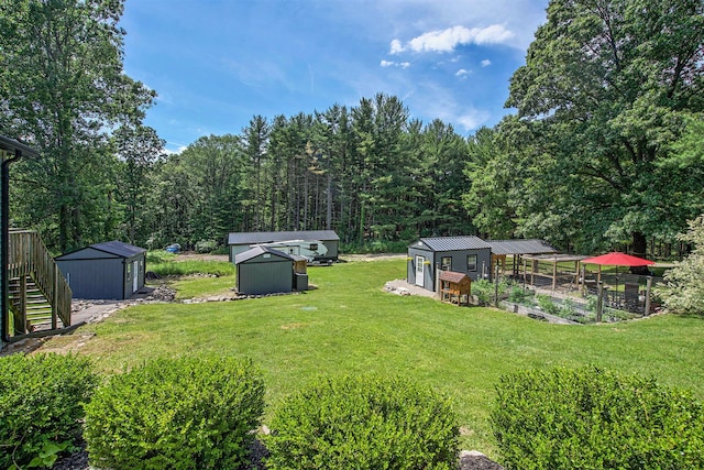 8041 Donovan Rd, Dexter, MI 48130 - view of green lawn featuring a storage shed