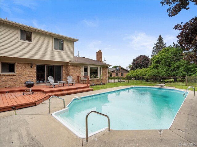 1890 Ludgate Ln, Rochester Hills, MI 48309 - view of pool with a wooden deck, area for grilling, and a diving board