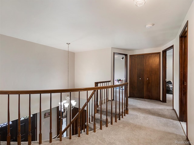 1890 Ludgate Ln, Rochester Hills, MI 48309 - hallway with carpet floors, a chandelier, and an upstairs landing