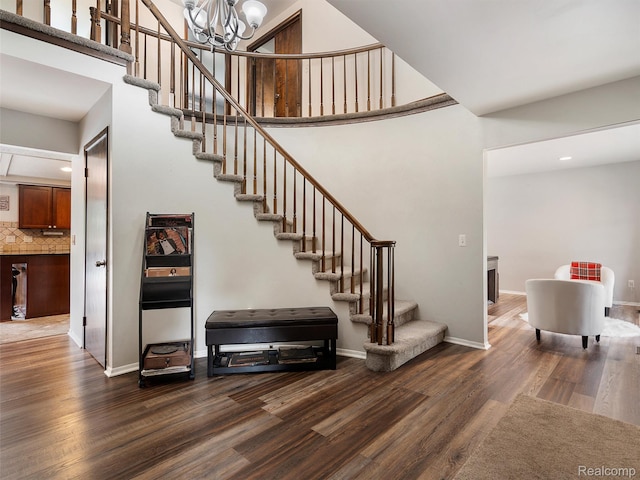 1890 Ludgate Ln, Rochester Hills, MI 48309 - stairway with wood finished floors, a chandelier, a towering ceiling, and recessed lighting
