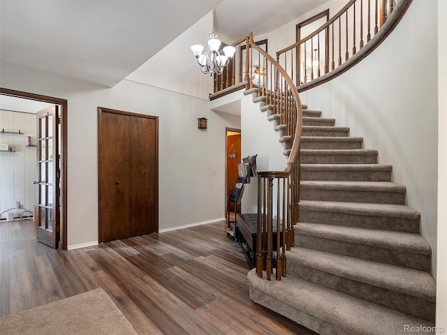 1890 Ludgate Ln, Rochester Hills, MI 48309 - stairway with wood finished floors and a chandelier