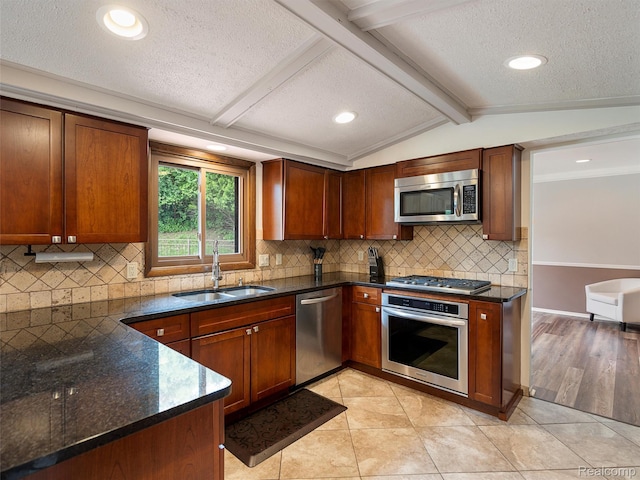 1890 Ludgate Ln, Rochester Hills, MI 48309 - kitchen with stainless steel appliances, a textured ceiling, dark stone counters, recessed lighting, and tasteful backsplash