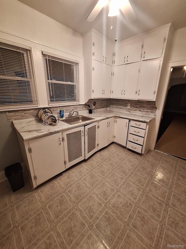 12645 Cloverlawn St, Detroit, MI 48238 - kitchen featuring white cabinets, light countertops, and a ceiling fan