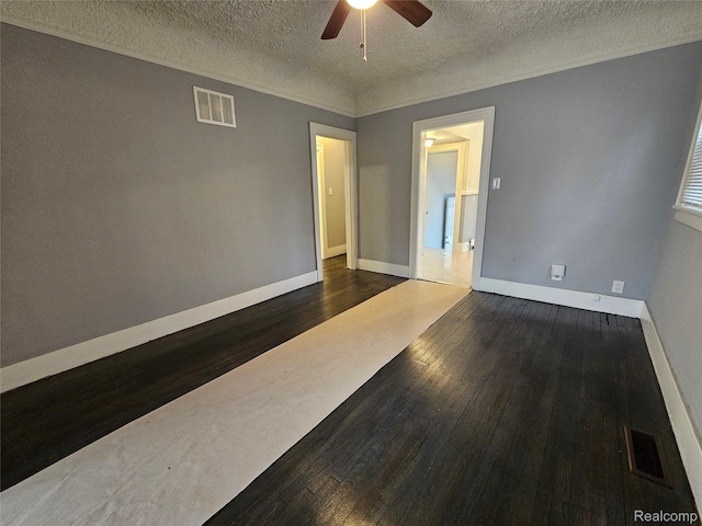 12645 Cloverlawn St, Detroit, MI 48238 - spare room featuring a ceiling fan, dark wood-style flooring, a textured ceiling, and crown molding