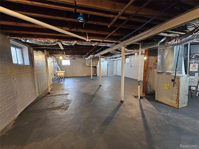 12645 Cloverlawn St, Detroit, MI 48238 - basement featuring water heater, heating unit, and healthy amount of natural light