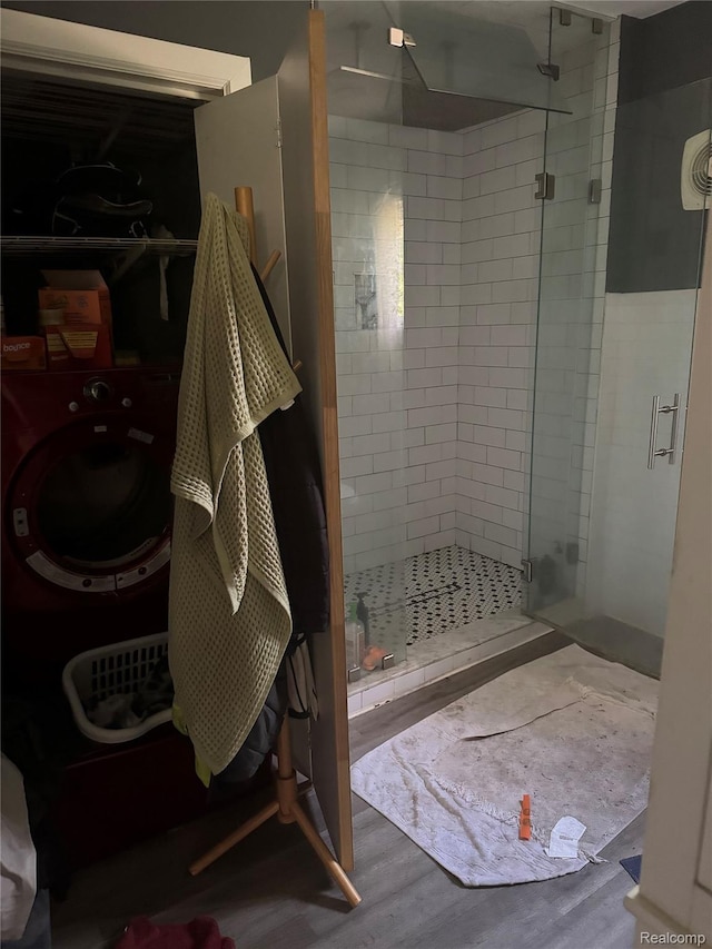 19374 Five Points St, Redford, MI 48240 - full bathroom featuring a stall shower, wood finished floors, and washer / clothes dryer