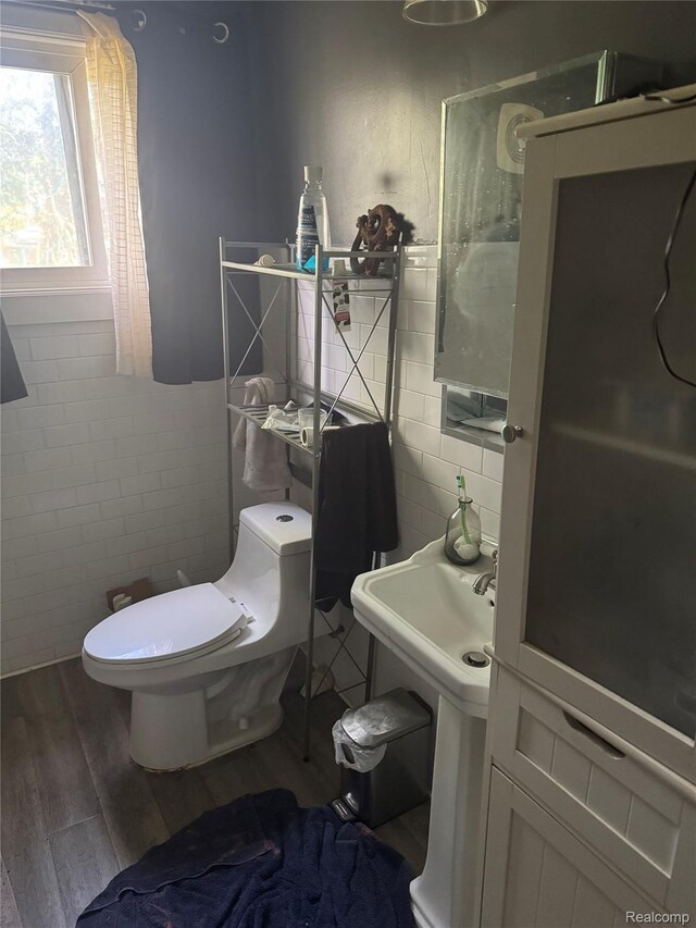 19374 Five Points St, Redford, MI 48240 - half bathroom featuring tile walls and wood finished floors