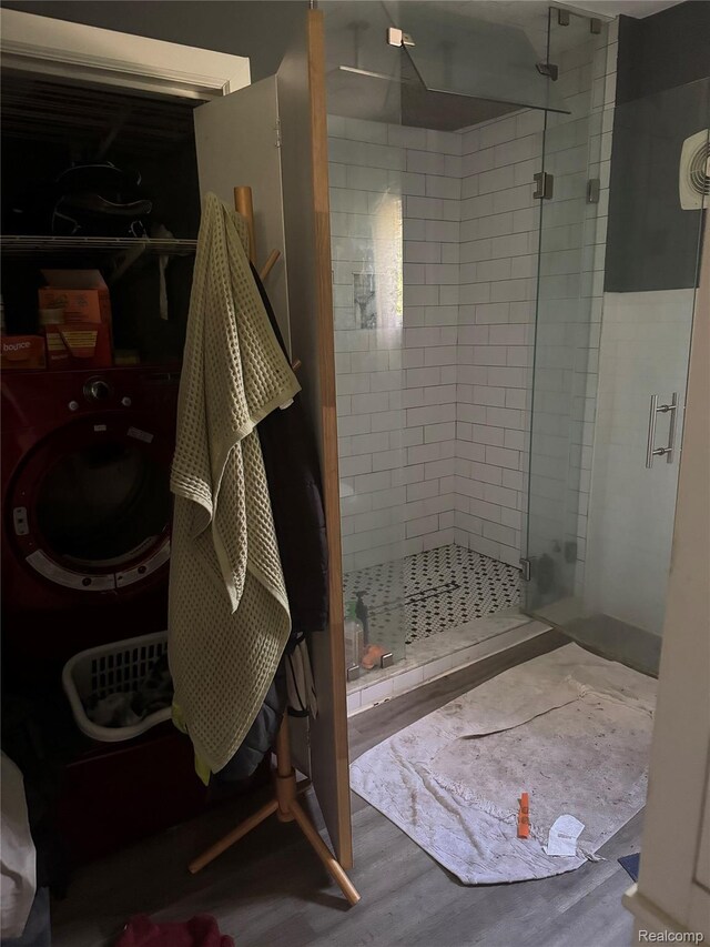 19374 Five Points St, Redford, MI 48240 - bathroom featuring a shower stall, wood finished floors, and washer / clothes dryer
