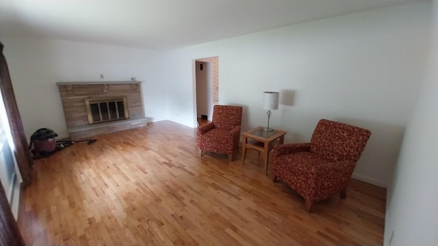 5037 Old Colony Rd, Portage, MI 49024 - sitting room featuring wood finished floors and a glass covered fireplace