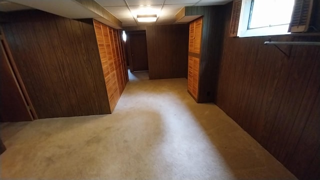 5037 Old Colony Rd, Portage, MI 49024 - basement with wooden walls, a paneled ceiling, and light colored carpet