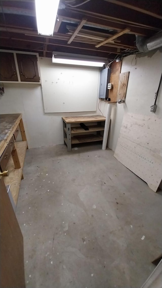 5037 Old Colony Rd, Portage, MI 49024 - unfinished basement with electric panel and a workshop area