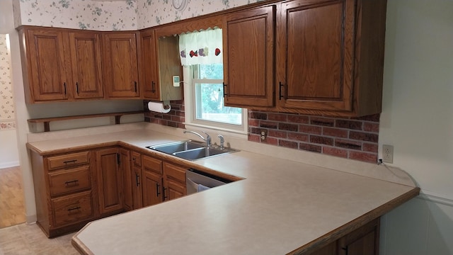 5037 Old Colony Rd, Portage, MI 49024 - kitchen featuring wallpapered walls, light countertops, brown cabinets, and dishwasher