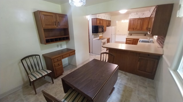 5037 Old Colony Rd, Portage, MI 49024 - kitchen with white appliances, a peninsula, brown cabinetry, and light flooring