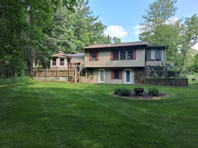 5397 E 80th St, Newaygo, MI 49337 - rear view of property featuring an outdoor fire pit, stairs, and a lawn