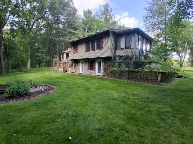 5397 E 80th St, Newaygo, MI 49337 - back of property featuring a wooden deck, a lawn, and stairway